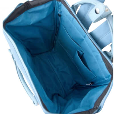 Interior view of Anello New Retro Kuchigane Backpack Slim showcasing spacious pockets and blue fabric lining.