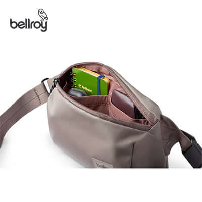 Inside view of the Bellroy Laneway Belt Bag showcasing its spacious pocket with cards and accessories.