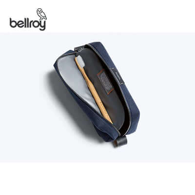 Bellroy Toiletry Kit Pouch shown with a toothbrush inside for organized travel essentials.