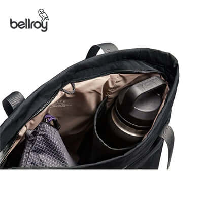 Interior view of the Bellroy Lite Totepack showing compartments and a water bottle.