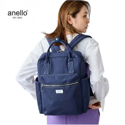 Woman wearing Anello Town Squared Backpack, a versatile corporate gift ideal for everyday use.