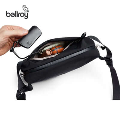 Bellroy Lite Sling Mini Bag showing interior with items for easy access, ideal as a Corporate Gift.