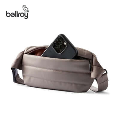 Bellroy Laneway Belt Bag with phone and accessories, perfect for travel and everyday use.
