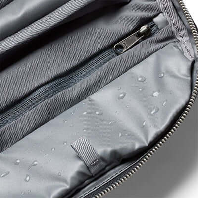 Interior of the Bellroy Toiletry Kit Plus highlighting water-resistant material and organized pockets.