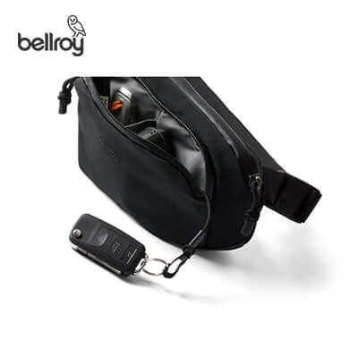 Bellroy Venture Hip Pack 1.5L showing its main compartment with a soft-lined phone sleeve and keychain.