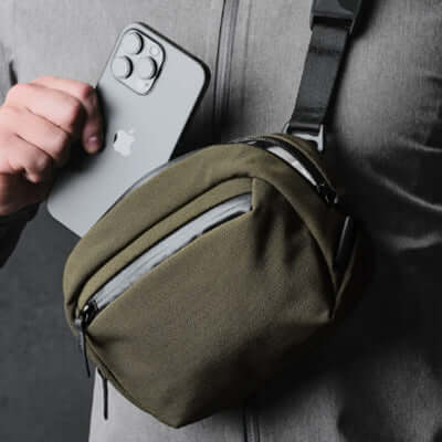 Alpaka Go Sling Nano 600D compact bag for everyday adventures, holding a smartphone.