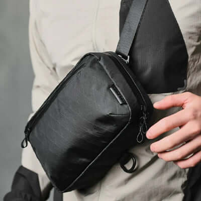 Alpaka Elements Tech Case Sling V2 X-Pac VX21 in use as a stylish sling bag for corporate gifts and everyday carry.