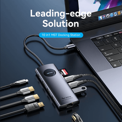 Vention 10-in-1 USB-C MST Docking Station connected to a laptop with various cables for enhanced workspace.