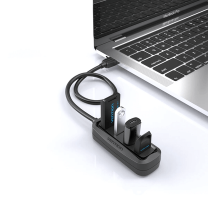 Vention 4-in-1 USB 2.0 Hub connected to a laptop, perfect for corporate gift solutions.