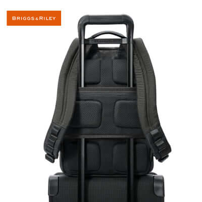 Briggs & Riley HTA Slim Expandable Backpack straps view on trolley suitcase, ideal corporate gift for professionals.
