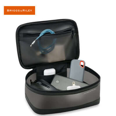 Briggs & Riley Translucent Essentials Case with travel essentials organized inside for the corporate gift.