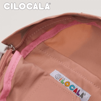 Inside view of Cilocala Star Print Backpack Small with colorful branding and pink lining.