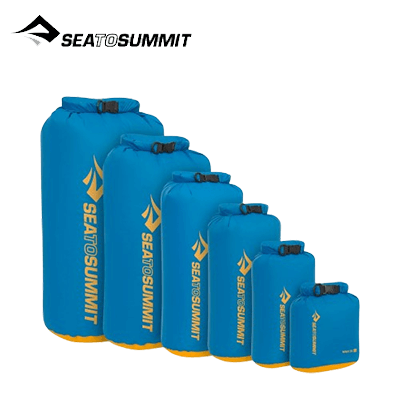 Sea To Summit Evac Dry Bag 5L and other sizes displayed in blue, ideal for travel and outdoor adventures.