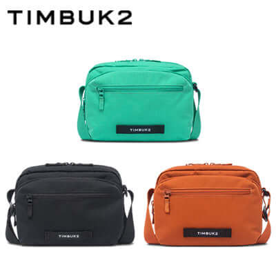 Timbuk2 Flight Crossbody Satchel in teal, black, and orange colors, ideal for eco-friendly and stylish carrying.