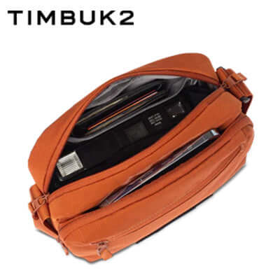 Timbuk2 Flight Crossbody Satchel in orange, featuring a spacious interior for essentials.