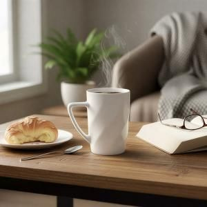 Brand Charger Ember - New Bone Cup with steaming coffee on a wooden table beside a croissant and a book.