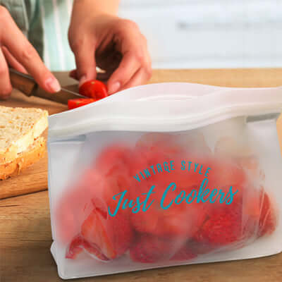 Reusable Pouch storing strawberries while preparing food on a wooden board, ideal for on-the-go organization.