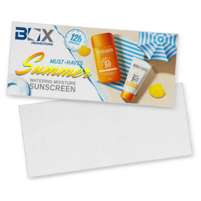 Santorini Beach Towel with summer sunscreen products, featuring must-have sun protection and beach essentials.