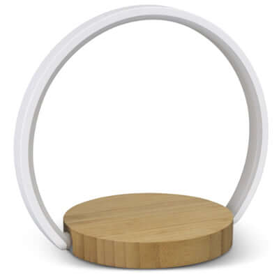 Twilight Wireless Charging Night Light with modern bamboo base and stylish design for bedside use.