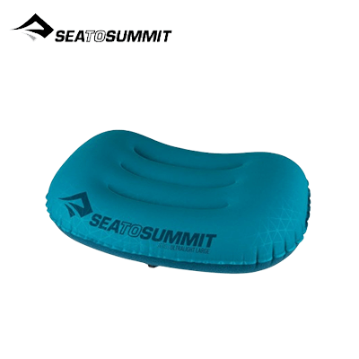 Sea To Summit Aeros Ultralight Pillow Regular in teal color with ergonomic design for outdoor comfort.