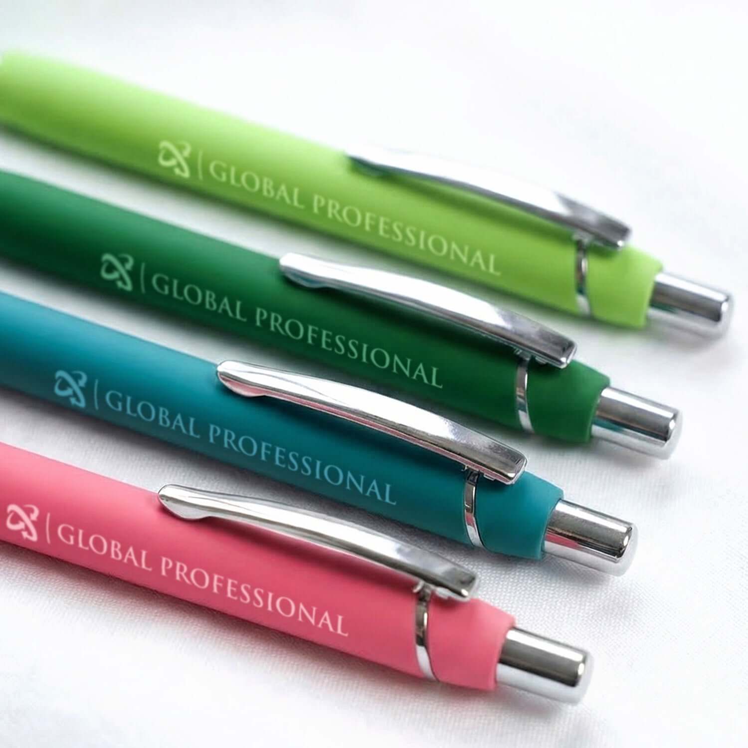 A collection of vibrant colored ballpoint pens with a rubberized finish, showcasing the Global Professional brand.