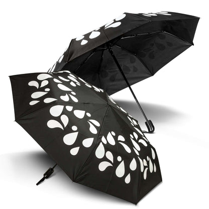 Colour Changing Compact Umbrella with black design and white droplets, ideal corporate gift in Singapore.