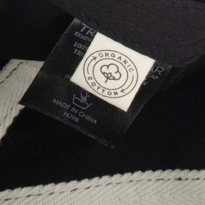 Essence Organic Cap label showcasing organic cotton certification and sustainable production.