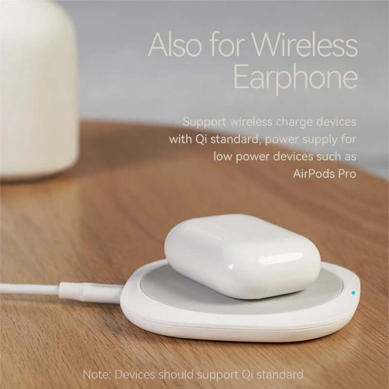 Vention Wireless Charger 10W supporting Qi charging for devices like AirPods Pro on a wooden surface.