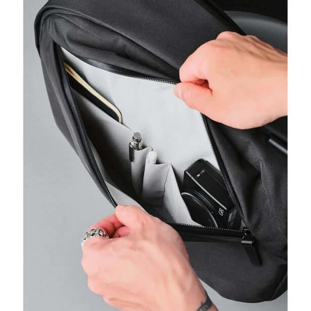 ALPAKA Metro Backpack Axoflux 300D interior showing organization pockets and accessories.