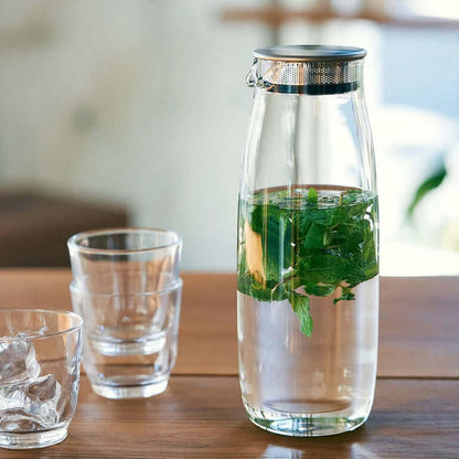 Kinto Unitea Water Carafe 1.1L with fresh mint leaves infusing in water, ideal for corporate gift.