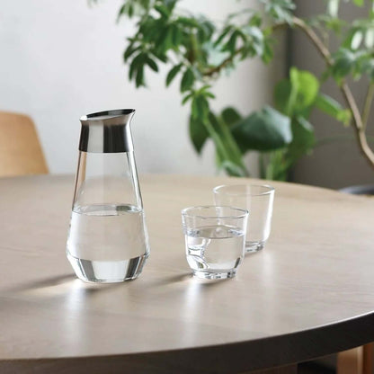 Kinto Luce Water Carafe 750ML with two glasses on a wooden table, ideal for corporate gift.