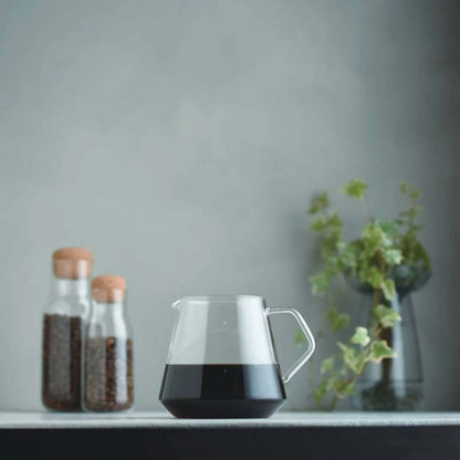 Kinto SCS-S02 Coffee Server 4Cups 700ML with coffee in a stylish setting.