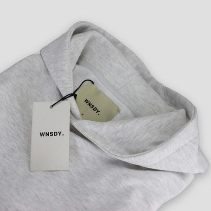 WNSDY Essential Hoodie close-up showing tag and fabric detail, ideal for corporate gift.