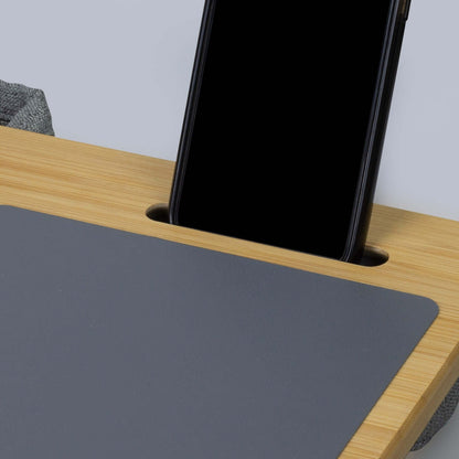 Close-up of the NATURA Bamboo Lap Desk showing the phone holder and surface for laptops or tablets.