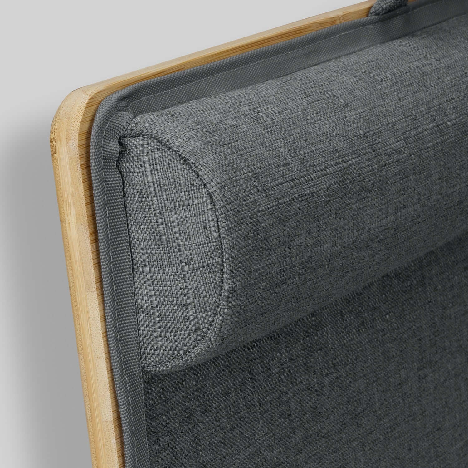 Close-up of the cushioned polyester base of NATURA Bamboo Lap Desk, showcasing its comfort and stylish design.