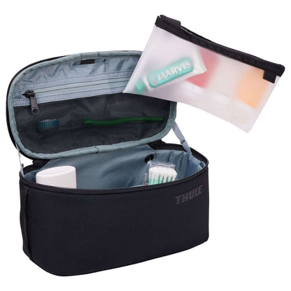 Thule Subterra 2 Toiletry Case open, featuring removable pouch for organized toiletries.