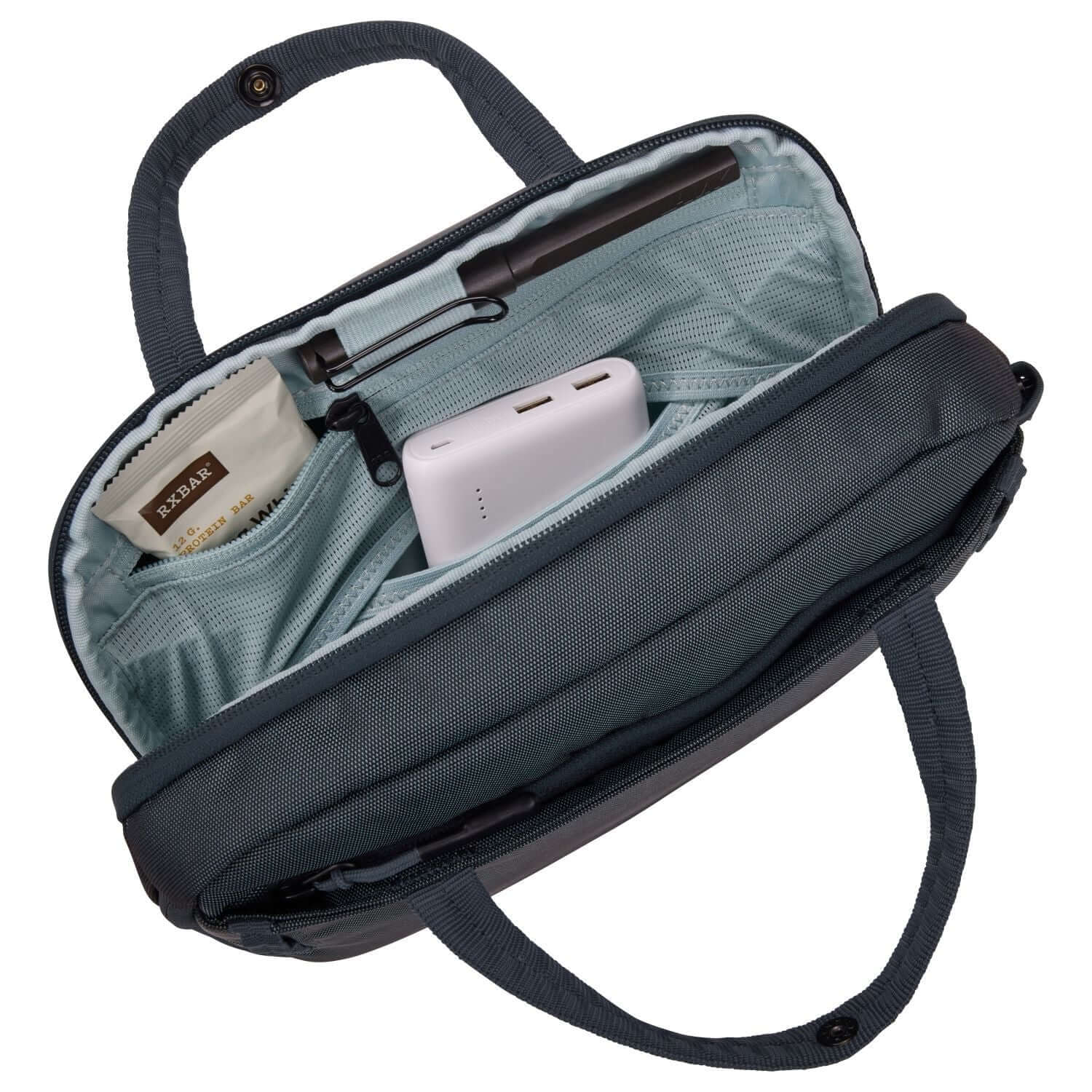 Thule Subterra 2 Crossbody 5L interior with organization pockets for travel essentials and a tech pouch.