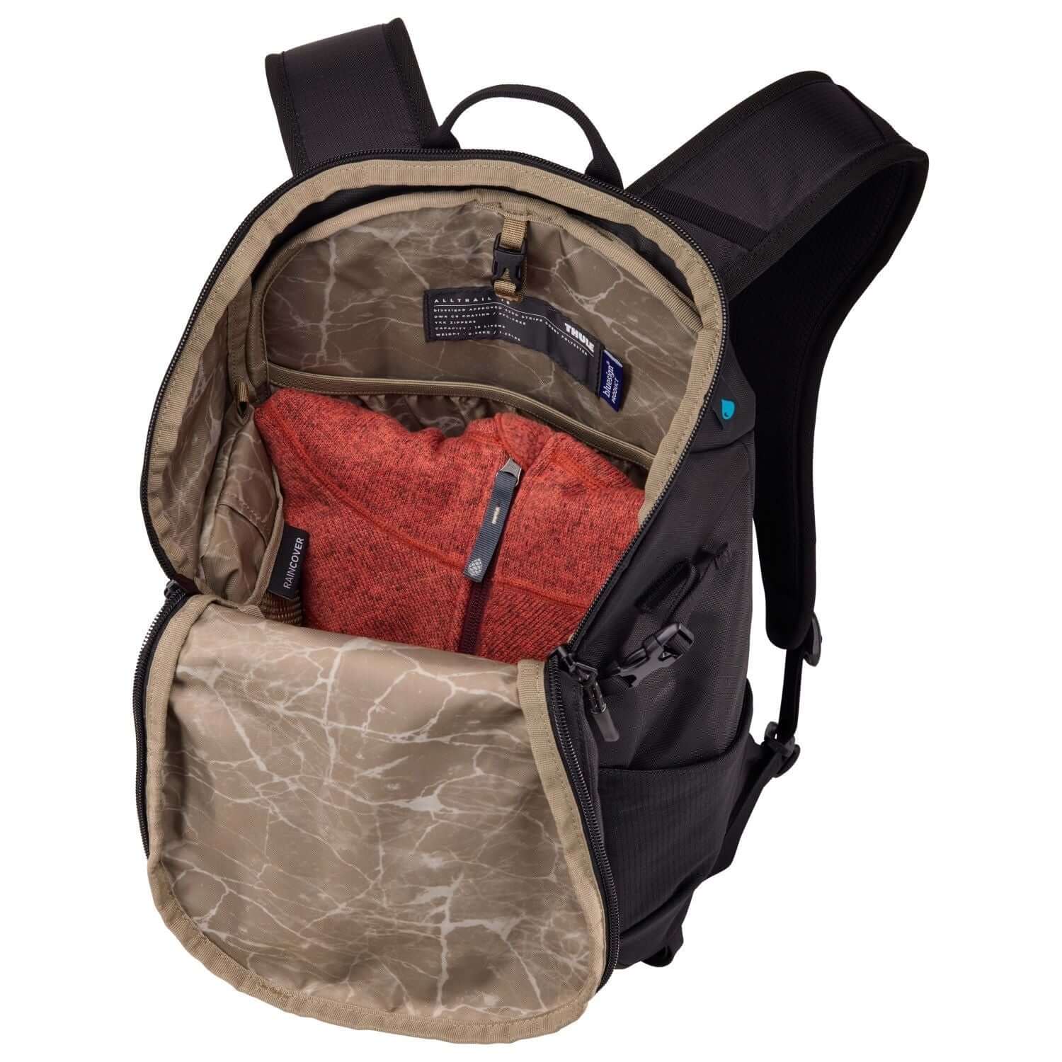 Thule Alltrail Daypack 18L interior view showcasing pockets and storage for adventure essentials.