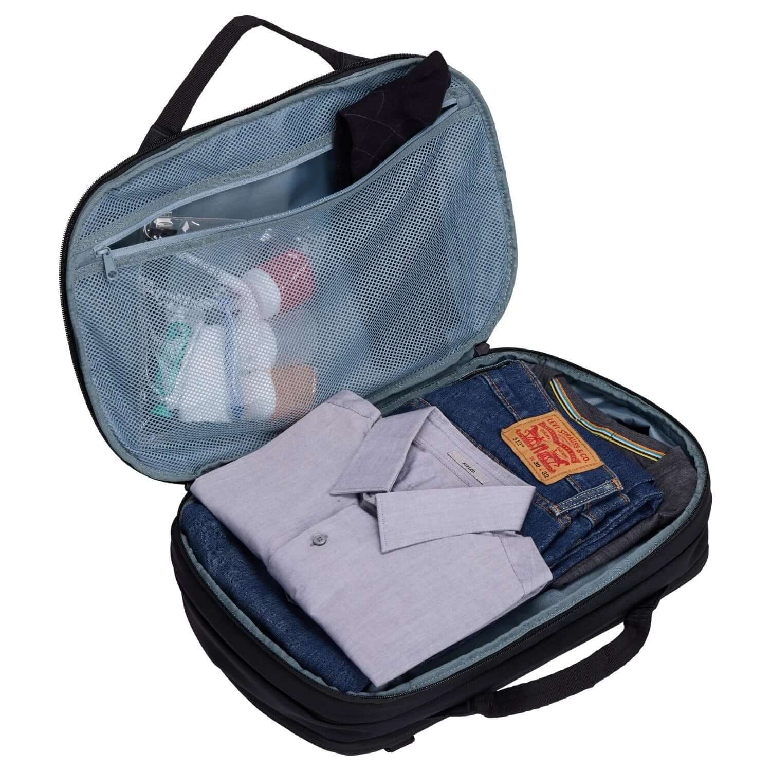 Interior view of Thule Subterra 2 Convertible Travel Bag 23L with packed clothing and toiletries.