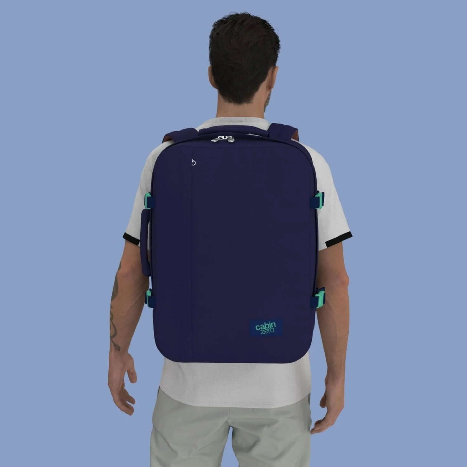 Cabinzero Classic Ultra Light Cabin Bag With Luggage Trackers 44L worn by a man from behind, showcasing its spacious design.