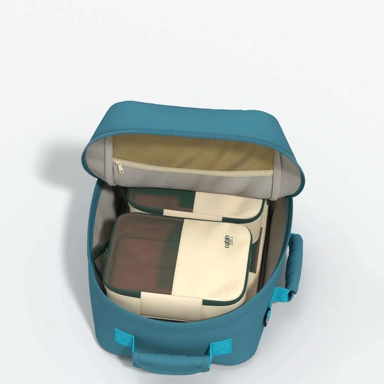 Cabinzero Classic Backpack 28L interior showing organized storage compartments and zippered pocket.