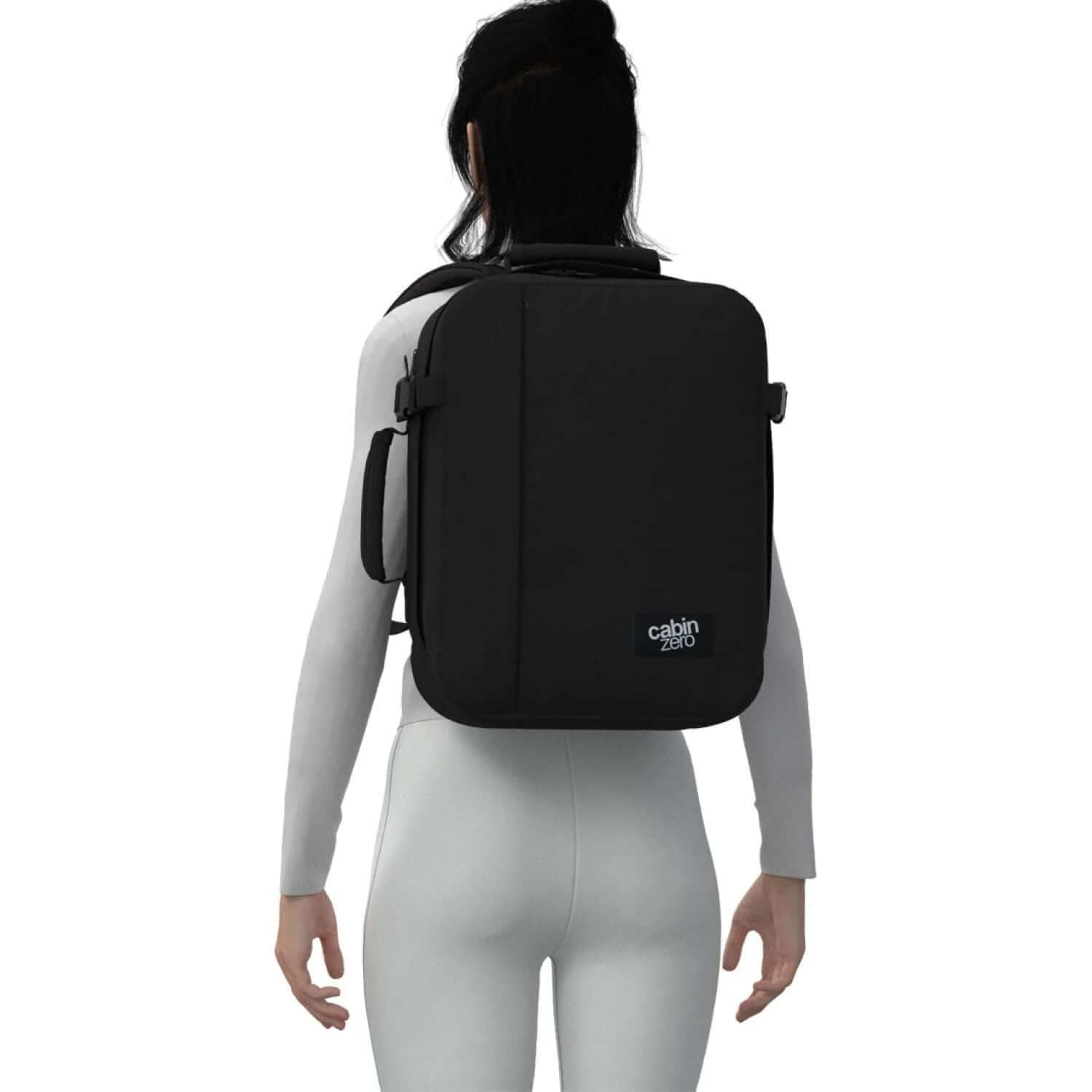 Cabinzero Classic Backpack 28L on a model's back, showcasing sleek design and functionality for travelers.