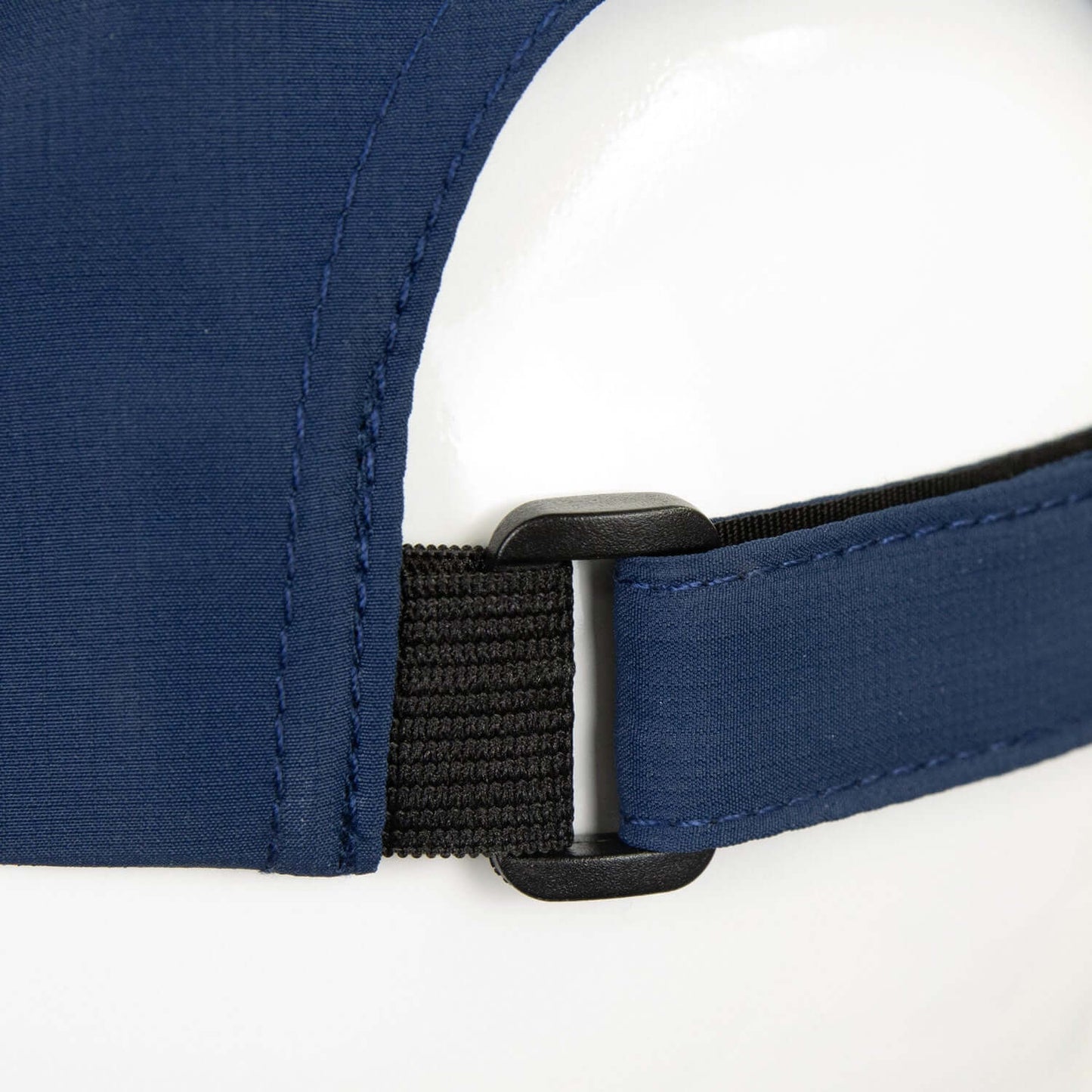 Close-up of adjustable Velcro strap on Lane Recycled Cap made from GRS certified recycled polyester.