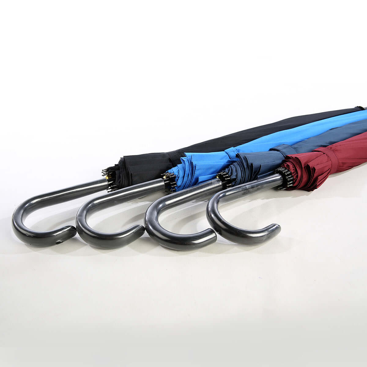25'' Umbrella with 16 Panels in black, blue, and maroon colors displaying stylish designs and curved handles.