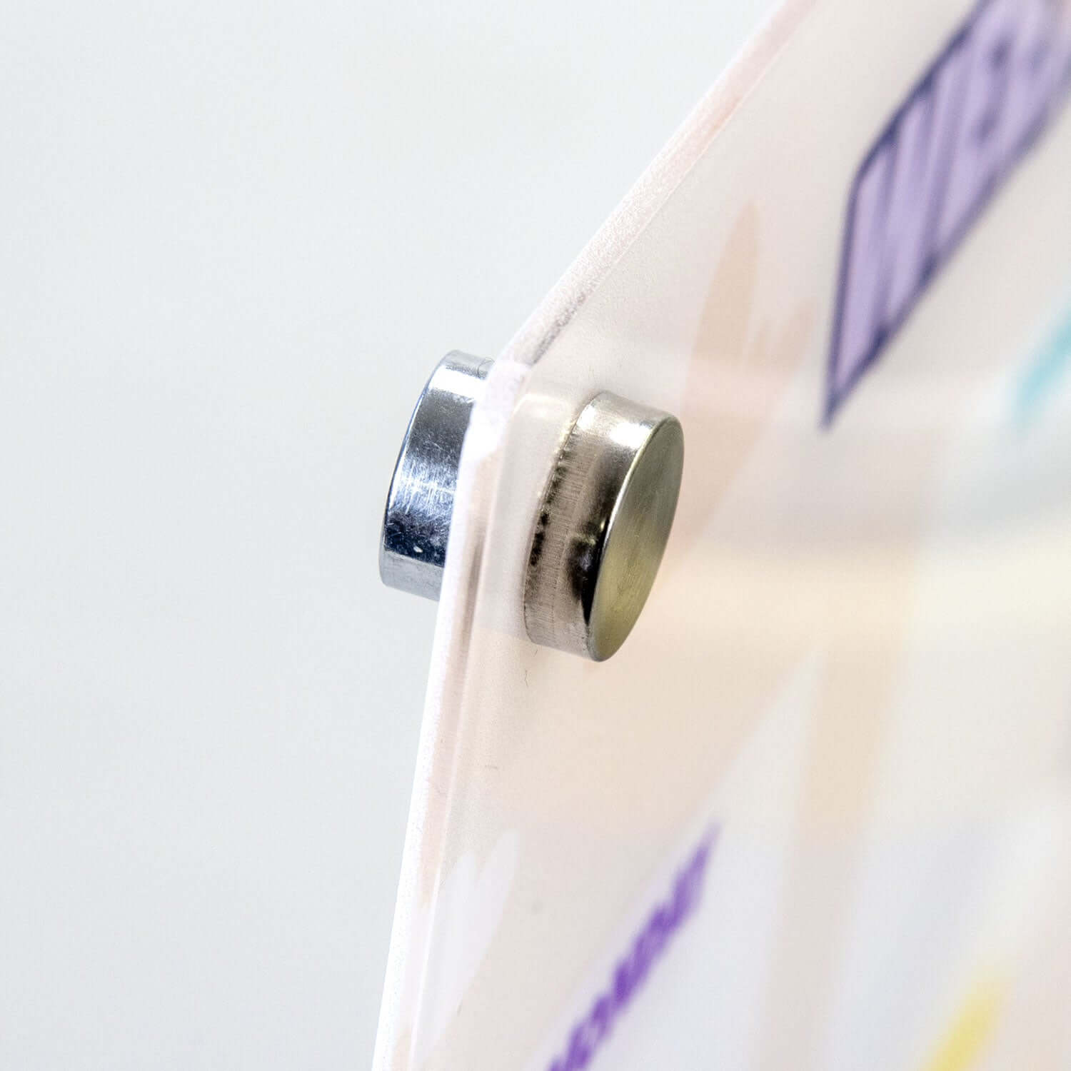 Close-up of the metal magnet on the Magnetic Fridge Planner, highlighting its secure attachment.