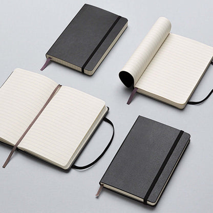 Moleskine Classic Soft Cover Notebook - Large displayed with various configurations and open pages, elegant design perfect for corporate gift.