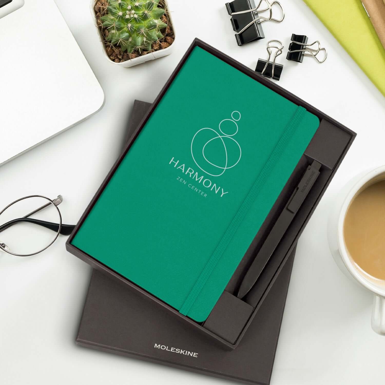 Moleskine Notebook and Pen Gift Set presented in a stylish box with a green notebook and pen.