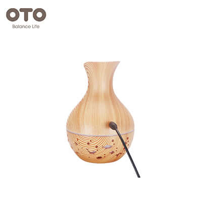 OTO Misty Humidifier in a stylish wood finish, designed to enhance air quality as a perfect corporate gift.