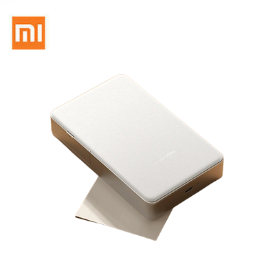 Xiaomi Portable Photo Printer Pro on a white background with a printed photo emerging, ideal for corporate gift.