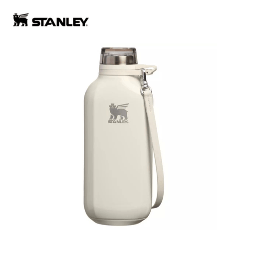 STANLEY The Clutch Water Bottle in light color with strap for easy carrying.